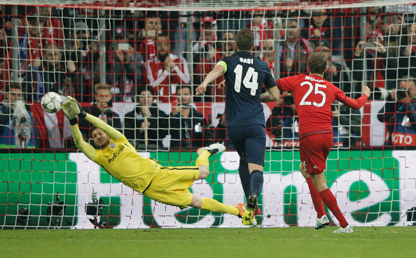 MUNICH, GERMANY - MAY 03: Goalkeeper Jan Oblak of Atletico Madrid (13) saves a penalty kick from Thomas Mueller of Bayern Munich (25) during UEFA Champions League semi final second leg match between FC Bayern Muenchen and Club Atletico de Madrid at Allianz Arena on May 3, 2016 in Munich, Germany. (Photo by Adam Pretty/Bongarts/Getty Images)