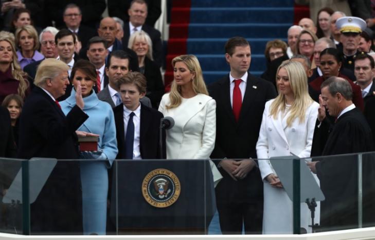U.S. President Donald Trump (L) takes the oath of office from U.S. Supreme Court Chief Justice John Roberts (R) with his wife Melania, and children Barron, Donald, Ivanka and Tiffany at his side during inauguration ceremonies at the Capitol in Washington, U.S., January 20, 2017. REUTERS/Carlos Barria