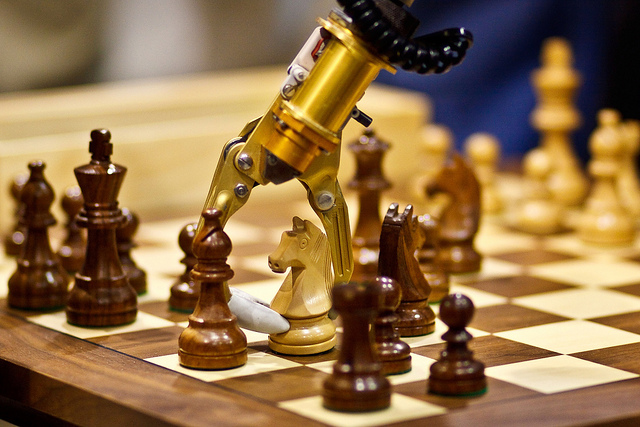 Robotic arm playing chess.