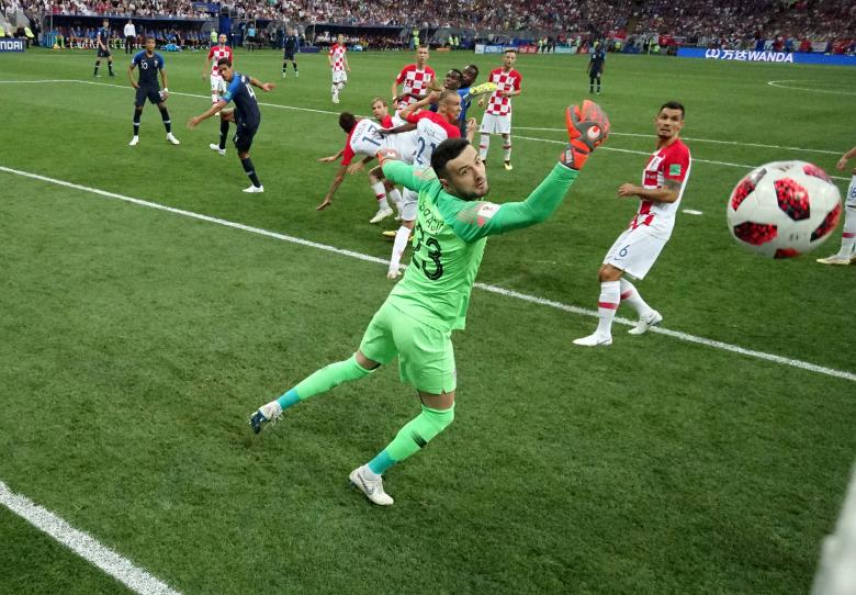 Croatia's Mario Mandzukic scores an own goal and the first for France. REUTERS/Pawel Kopczynski/Pool