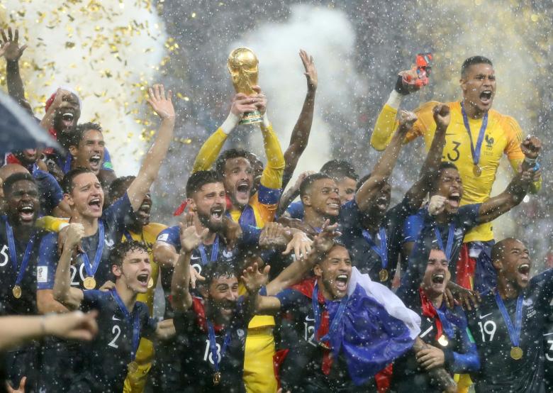 France's Hugo Lloris lifts the trophy as they celebrate winning the World Cup. REUTERS/Carl Recine